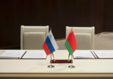 Belarus and Russia, a table for signing documents. Official documents for signatures, pens and flags of States on the table.