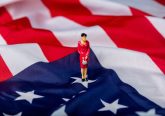 Miniature figure of a female politician on the USA flag